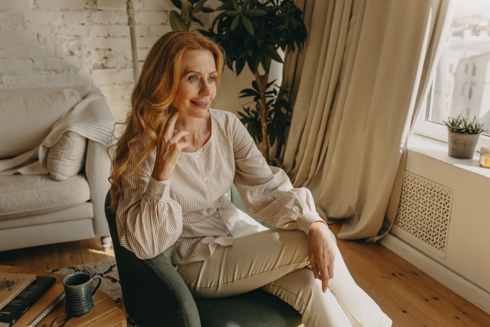 Woman sitting in a chair and smiling