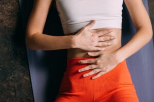 woman touching stomach