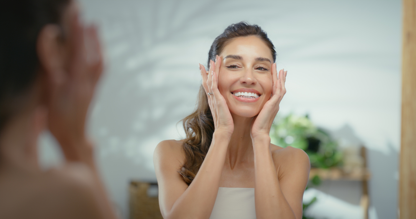 woman looking in mirror